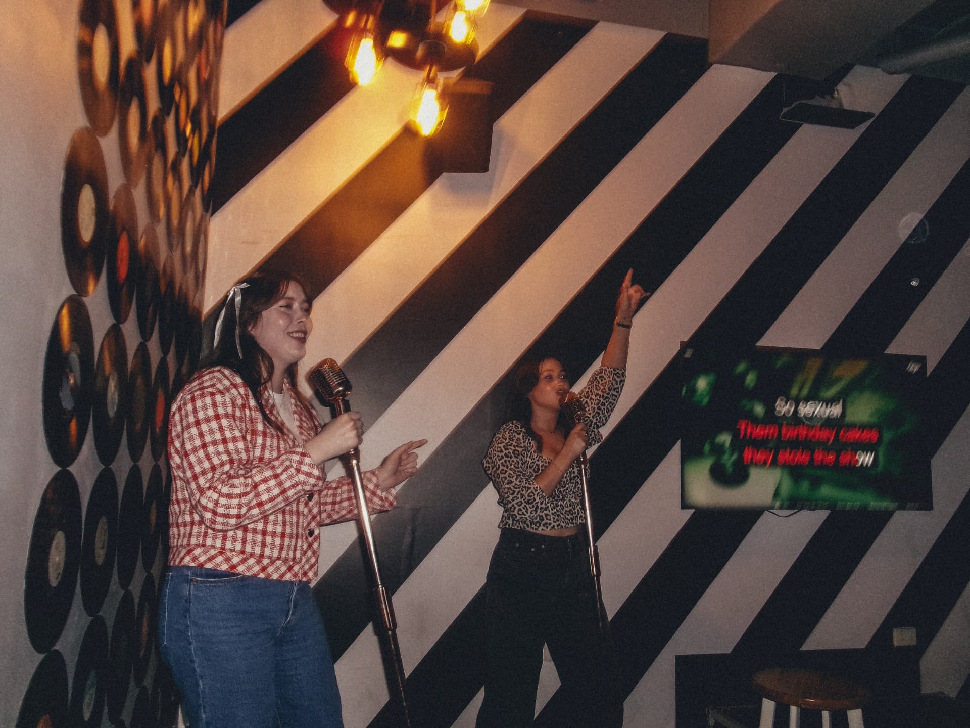 Members singing karaoke on a club night out