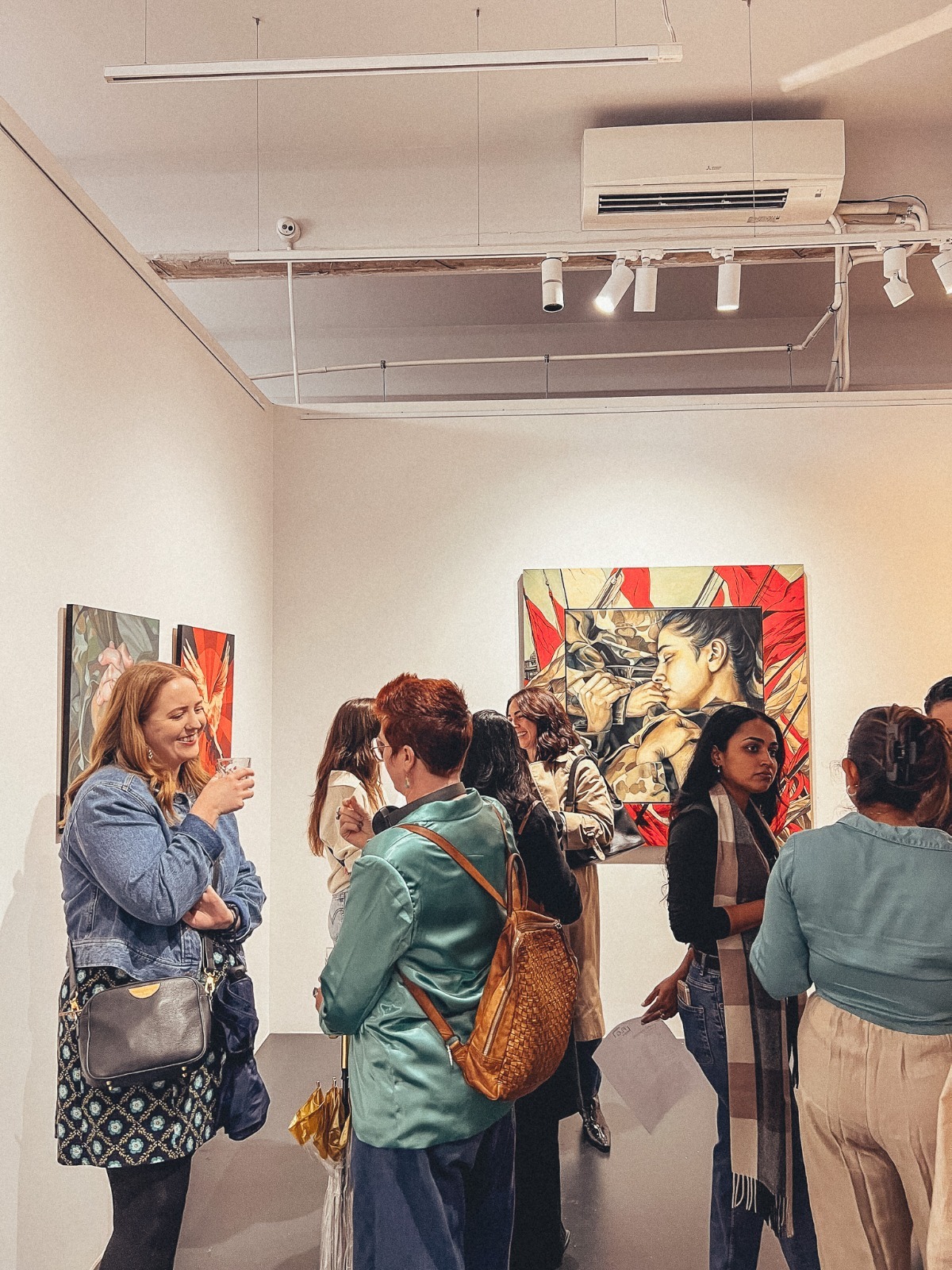 Members chatting at a club gallery visit