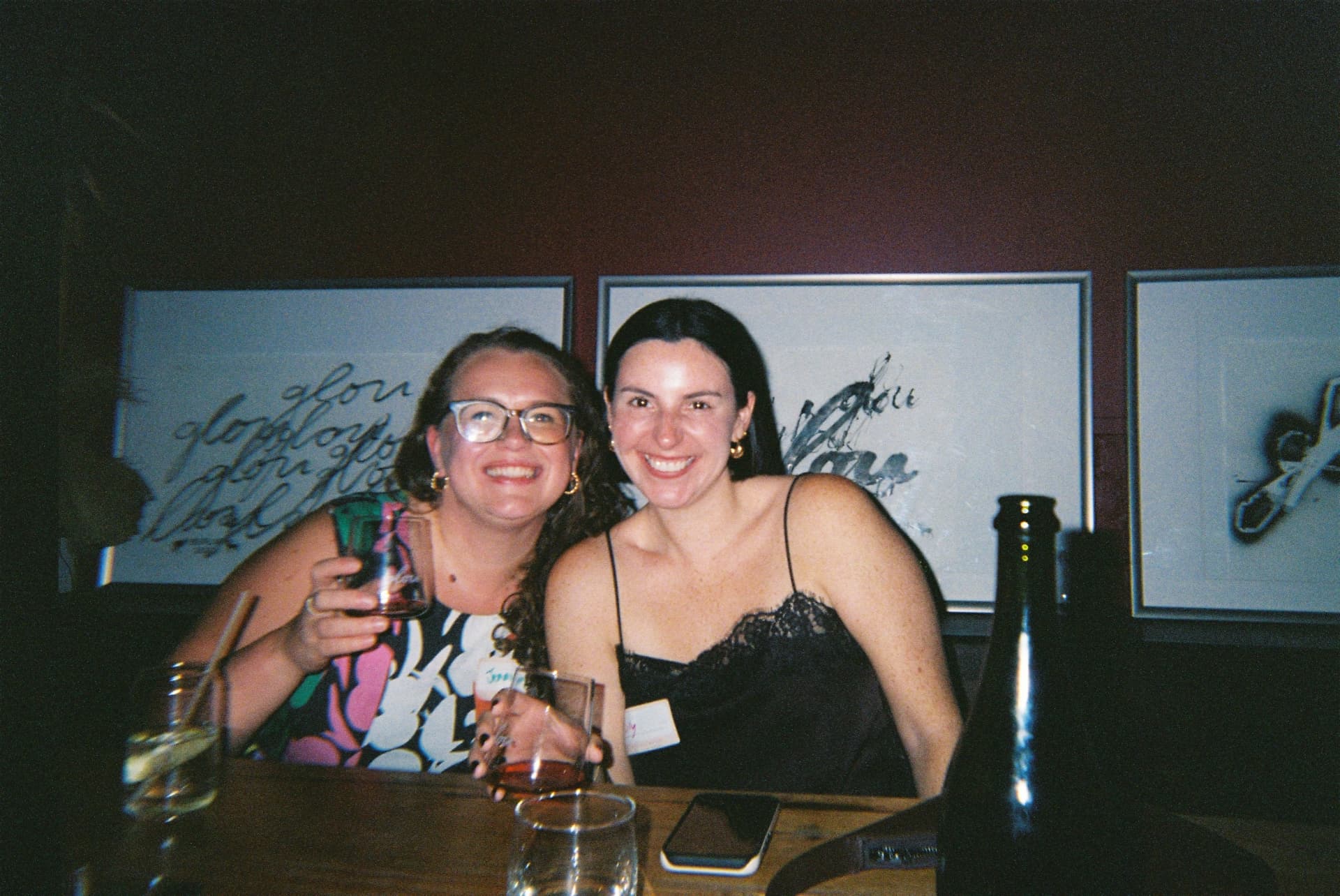 Members sharing a laugh and drinks on a club night out